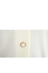 white cardigan button