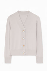 A light beige knit cardigan sweater with a V-neck, long sleeves, and four decorative gold buttons down the front, displayed on a clean white background.